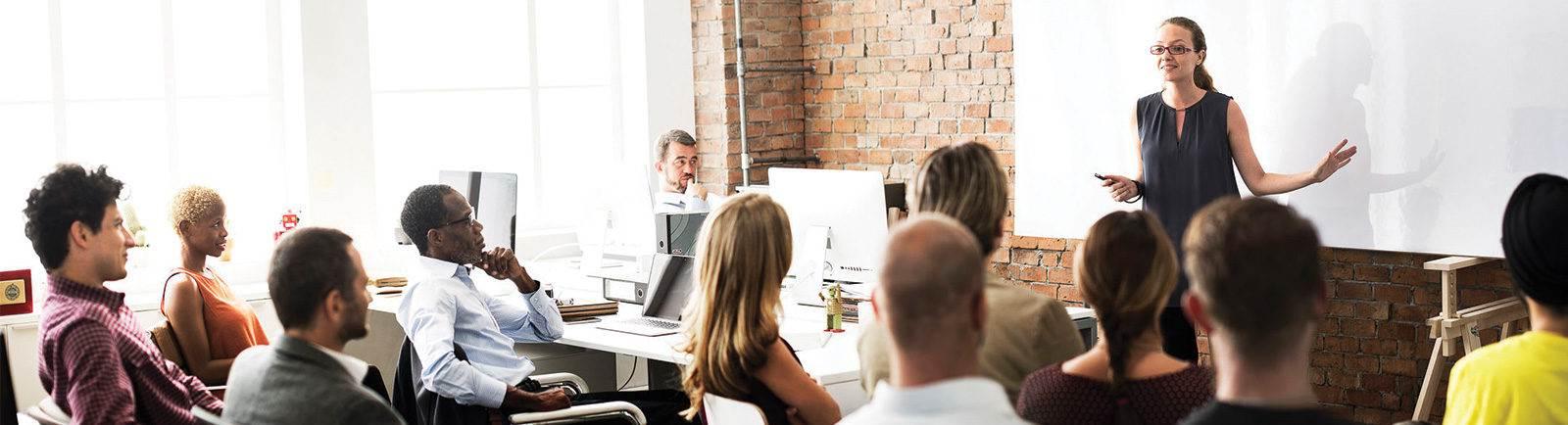 group of professionals sitting in a meeting